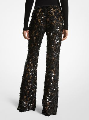 Intricately tailored in floral lace with nude silk lining these trousers are an ultra-romantic upgrade to basic flares. Featuring elaborate paillette hand-embroidery they’re designed with a concealed side-zip fastening and scalloped hem. Wear yours with a coordinating tunic or a shoulder-baring blouse. Chic Embellished Bottoms For Wedding, Chic Embellished Wedding Bottoms, Chic Lace Evening Bottoms, Chic Lace Bottoms For Evening, Elegant Fitted Pants For Festive Occasions, Luxury Fitted Wedding Bottoms, Embellished Pants For Fall, Fitted Embellished Pants For Fall, Fitted Sequin Luxury Pants