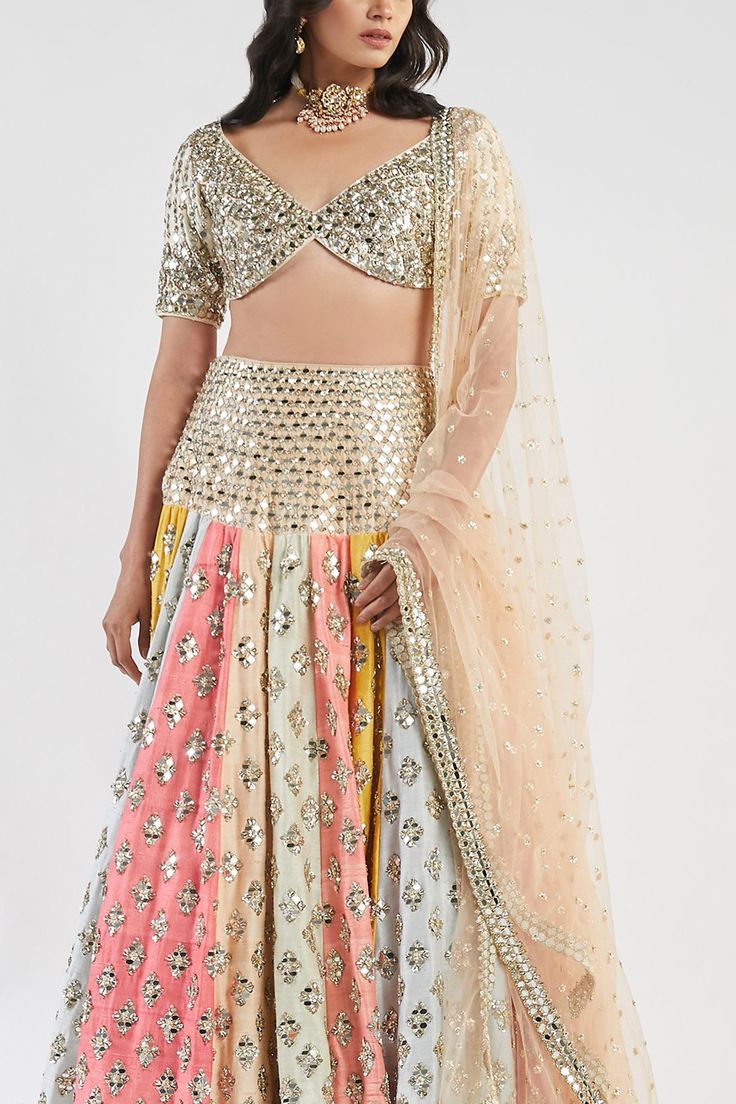 Multi-color drop-waist panelled lehenga with all-over mirror, sequin and zari work. Comes with embellished blouse and dupatta.
Component: 3
Embroidered
Neckline: V Neck
Sleeve Length: Half
Fabric:  Blouse &Lehenga: Raw silk; Dupatta: Net
Color: Multi Color
Drop waist
Panelled lehenga
Tassel tie-up back - Aza Fashions Panelled Lehenga, Abhinav Mishra, Blouse Lehenga, Color Blouse, Multi Color Blouse, Embellished Blouse, Zari Work, Embroidered Neckline, Silk Dupatta