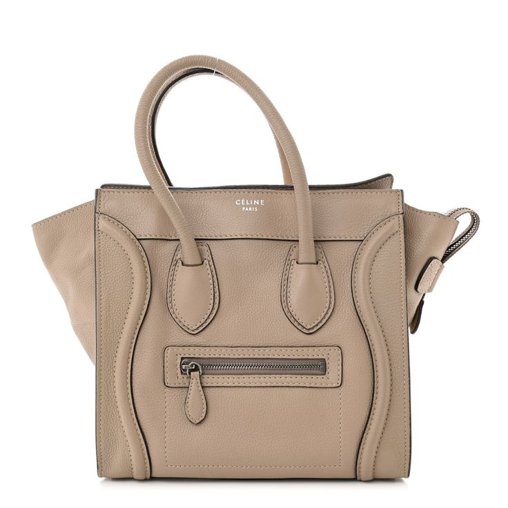 This is an authentic CELINE Drummed Calfskin Micro Luggage in Dune. This bag is crafted of luxurious pebbled calfskin leather in beige. It features rolled leather top handles, expandable sides, a frontal zipper pocket, and decorative leather trim. The top zipper opens to a fabric interior with zipper and patch pockets. Leather Top, Leather Trim, Leather Trims, Patch Pocket, Drums, Calf Skin, Zipper Pocket, Handles, The Top