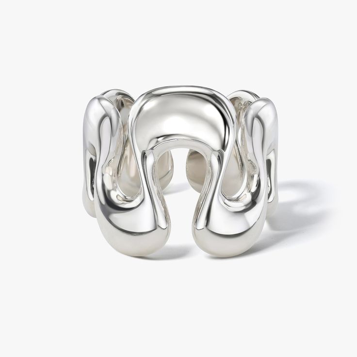 Our Boldest Ring yet. This sterling silver version of our Sené Ring is a statement ring like no other. Inspired by curving lines in Afro-modernist architecture from Senegal, this showstopper is an unforgettable piece that brings all the chic to any look. Choose between two finishes: A soft matte "Brushed Satin" finish and ultra glossy "High Polish". The interior of both styles is smooth high polish for a comfortable fit. We recommend ordering half a size larger than your usual to ensure the best Modern Open Band Jewelry With Shiny Finish, Modern Dome Ring With Open Band, Modern Open Ring With Shiny Finish, Contemporary Open Band Rings For Formal Occasions, Sculptural Jewelry With Polished Finish For Formal Occasions, Contemporary Sculptural Jewelry For Formal Occasions, Modern Sterling Silver Dome Ring With Open Band, Modern Jewelry With Ring Detail, Contemporary Silver Open Band Jewelry