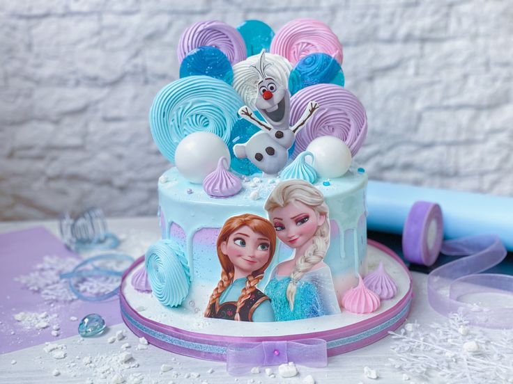 there is a frozen princess cake on the table