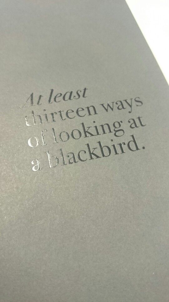 an open book with the words 4 least thirteen ways to looking at blackbird