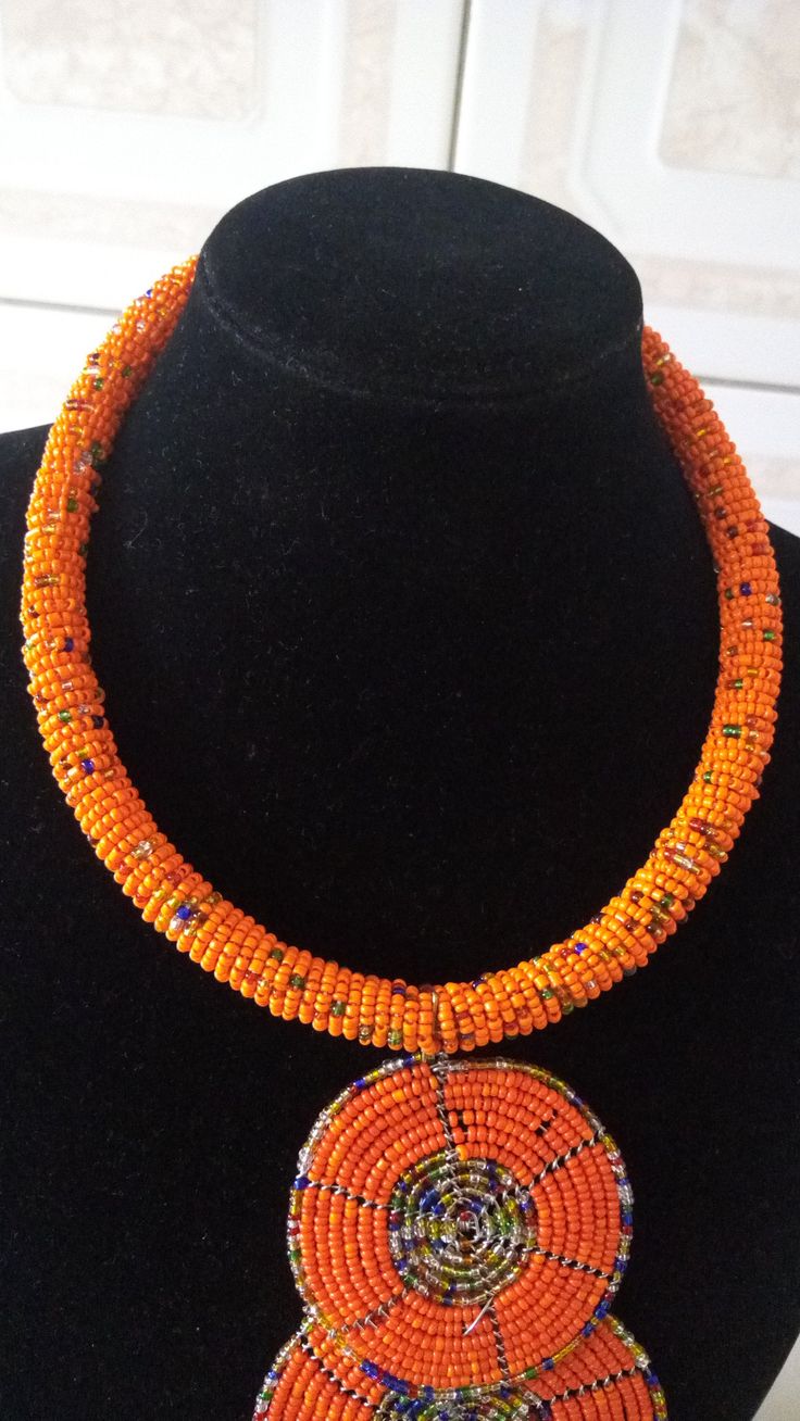 Beaded Necklace | African Jewelry | African Maasai Beaded Necklace | Statement Necklace | Ethnic Jewelry | Gift For Her | Orange Pendant Necklace This statement necklace is made from beads. Main Color -Orange. Feel free to send me a convo or e-mail for any clarification or more information. Thank you for visiting, Traditional Colorful Beaded Necklaces For Celebrations, Traditional Beaded Necklaces For Celebrations With Colorful Beads, Traditional Tiny Beads Necklace For Festivals, Traditional Beaded Necklaces For Celebration With Polished Beads, Traditional Beaded Necklaces For Celebration, Traditional Beaded Necklaces With Round Beads For Festivals, Traditional Ceremonial Beaded Necklaces With Colorful Beads, Traditional Beaded Bracelets With Round Beads For Celebrations, Traditional Beaded Bracelets For Celebration With Round Beads