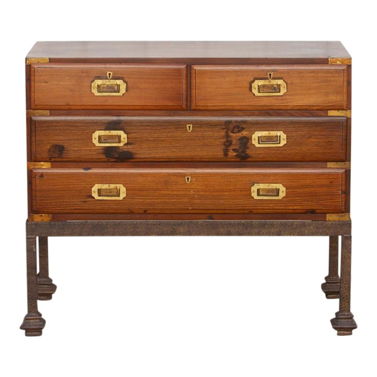 an old wooden dresser with brass handles on it's sides and two drawers in the middle