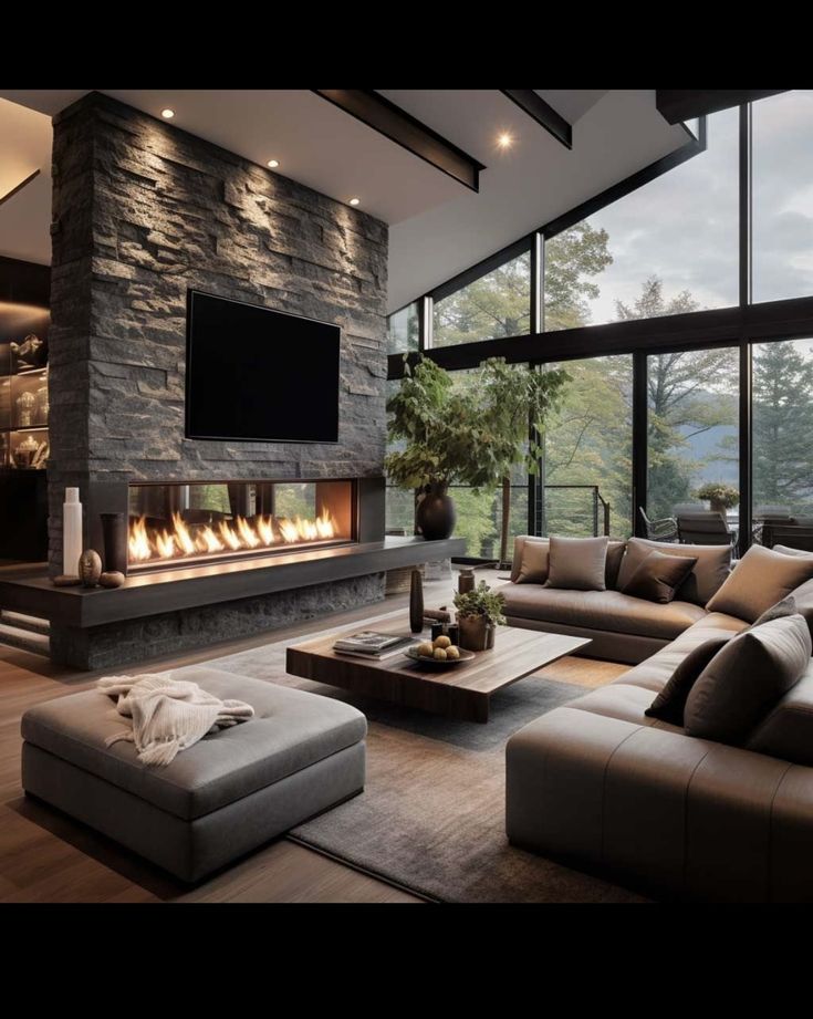 a modern living room with stone fireplace and large windows