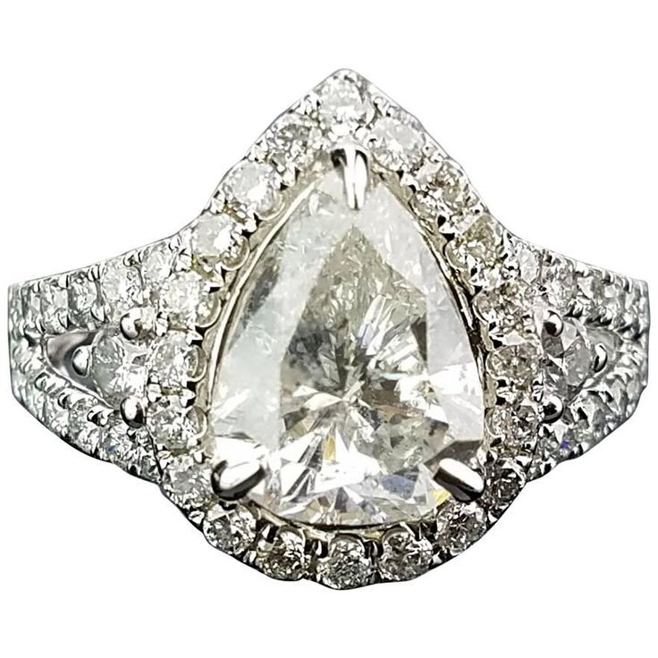 Statement pear shape diamond ring, with half moon side stones. Diamond Details: Cut: Pear shape Carat Weight: 2.18 carat Quality: I Cut: Half moon Carat Weight: 0.12 carat Quality: SI/I Cut: Brilliant (round) Carat Weight/l 0.70 Quality: SI/I 18K Gold: 4.89 grams Can provide certificate upon request. Can change ring size upon request. Can provide cleaning/re-polish service before shipping, upon request. Teardrop Diamond Cut Diamond Ring, Gia Certified Pear-shaped Diamond Ring, Gia Certified Teardrop Diamond White Diamond Ring, Gia Certified Teardrop White Ring, Gia Certified Teardrop Diamond Ring For Formal Occasions, Formal Gia Certified Teardrop Diamond Ring, Gia Certified Teardrop Diamond Ring For Anniversary, Gia Certified Teardrop Diamond Ring, Elegant Gia Certified Teardrop Diamond Ring