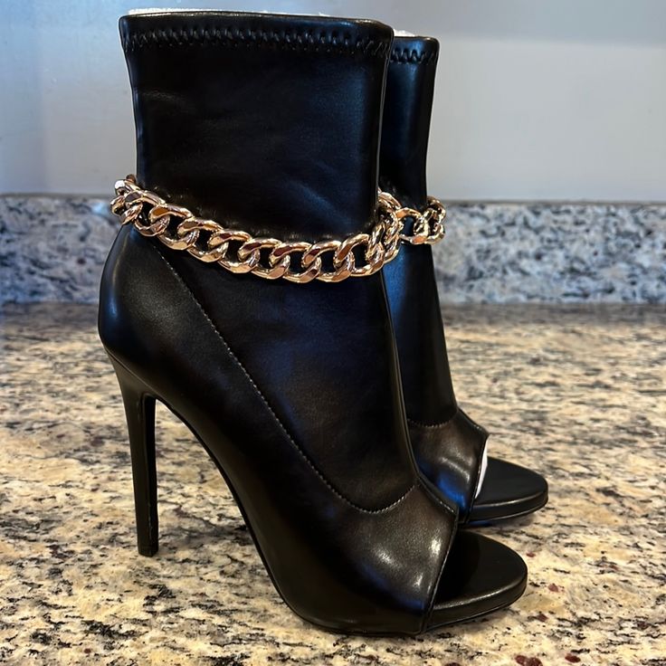 Steve Madden Faux Leather Heeled Open Toe Boots In Black With Silver Chain Embellishment - Inside Zip Closure - Ankle Material Has Stretch - Brand New - No Box - No Tags - Some Mild Material Wrinkling At Tops From Department Store Storage Without Support Inserts As Pictured - Pu Upper, Pu & Fabric Lining - Pu Sock - Manmade Outsole - Size 7m - Shelfm-Bin3 Faux Leather Ankle Strap Party Boots, Party Boots With Ankle Strap Medium Width, Elegant Open Toe Faux Leather Boots, Party Boots With Ankle Strap, Open Toe Leather Party Boots, Leather Open Toe Party Boots, Open Toe Faux Leather Boots For Night Out, Faux Leather Open Toe Boots For Night Out, Glamorous Open Toe Boots For Night Out