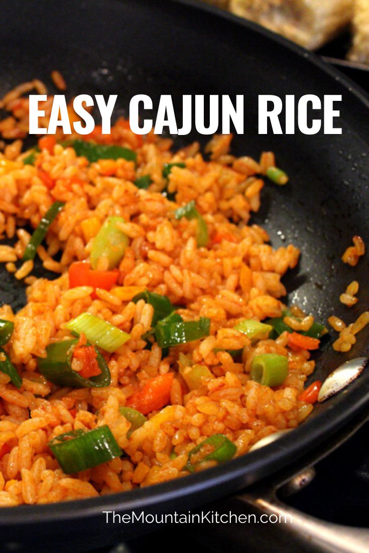 an easy cajun rice recipe with peppers and green bell peppers in a skillet