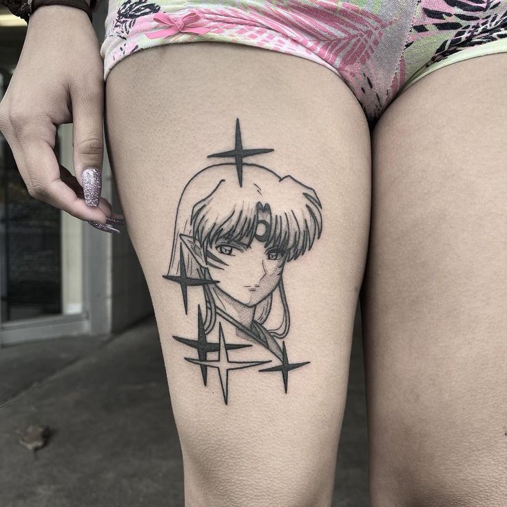 a woman's thigh with a tattoo on it