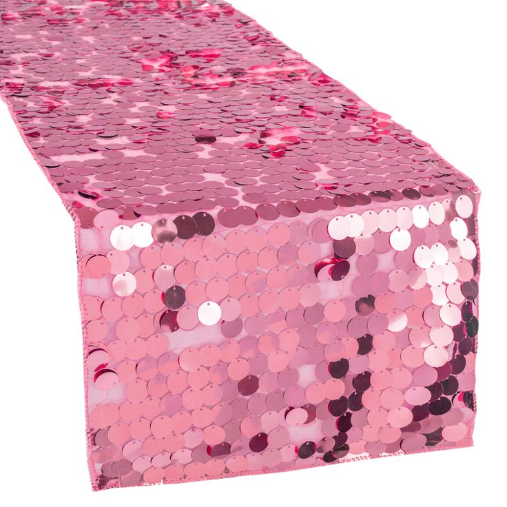 pink sequin table runner on white background