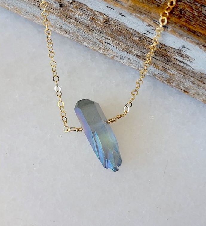 This product is made of metal alloy (silver and copper and other metal alloy) with high quality plating (It will last for a long time without tarnish). Handmade with love in Sausalito, California | A Blonde and Her Bag. One Single Raw Rainbow Quartz Crystal Pendant Necklace in Gold Single Raw Mystic Grey Quartz Crystal Pendant Necklace in Gold. Size: 16" Necklace with 1" Long Stone. Hypoallergenic | 1-800-Flowers Birthday Delivery Single Mystic Grey Qtz Crystal Pendant Necklace In Gold Spiritual Gold Crystal Necklaces, Gold Spiritual Crystal Necklaces Nickel Free, Iridescent Nickel-free Spiritual Necklaces, Iridescent Metal Necklace Gift, Nickel-free Metal Spiritual Crystal Necklace, Spiritual Metal Crystal Necklaces As Gift, Iridescent Jewelry With Adjustable Chain For Gift, Spiritual Iridescent Necklace For Gifts, Iridescent Necklace With Adjustable Chain For Gift