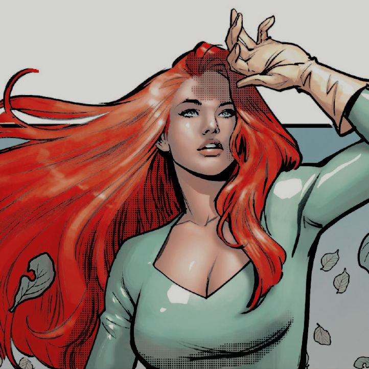 a woman with long red hair standing in front of a wall and holding her hands behind her head