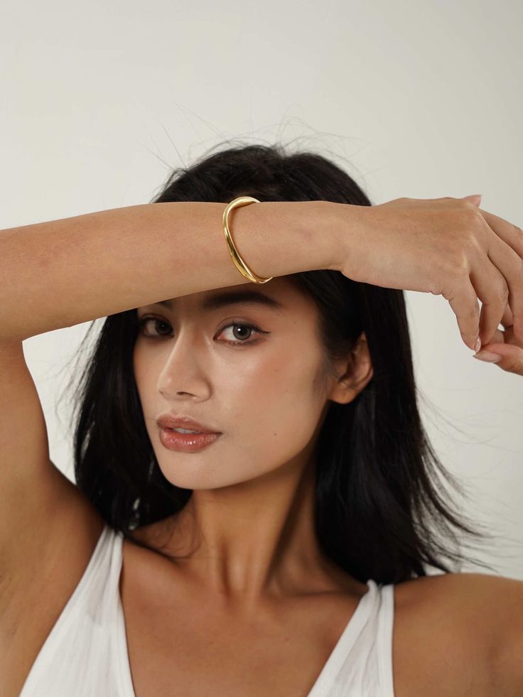 Discover the modern artistry of our Abstract Open Cuff Bracelet. Featuring a unique, flowing design, this bracelet blends contemporary style with effortless elegance. Gold Cuff Bangle, Chunky Gold Hoop Earrings, Open Cuff Bracelet, Flow Design, Herringbone Necklace, Gold Plated Bangles, Open Bangle, Gold Bracelet Cuff, Gold Cuffs