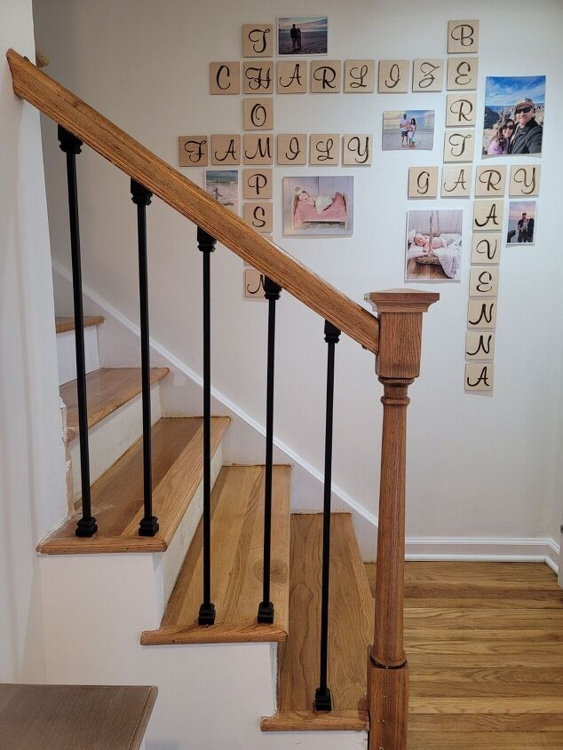 there is a stair case with pictures on the wall