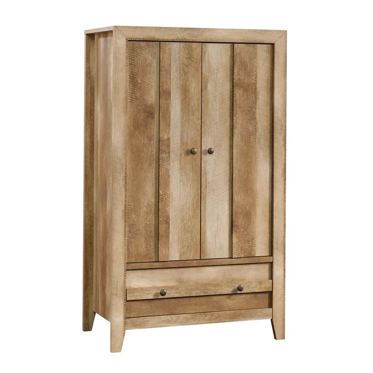 Take a pass on the ordinary. Make a bold statement with this armoire from the Dakota Pass® collection. This impressive 2 door armoire cabinet features a large lower drawer with metal runners and safety stops for items like denim, linens, sweaters and more. A garment rod in this wardrobe closet allows for easy hanging storage of items like dresses, button-down shirts, skirts and slacks. Keep your favorite clothes looking interview ready with this clothing storage furniture. An adjustable shelf behind the doors allows for customizable storage options for additional items like shoes, small organizing bins, and more. Traditional rustic country Craftsman Oak® finish and details with a contemporary sensibility make this design a favorite accent to nearly anywhere in the house where you need that Armoire Cabinet, Country Craftsman, Innovative Furniture, Bedroom Armoire, Wardrobe Drawers, Traditional Rustic, Garment Racks, Adjustable Shelf, Small Organization