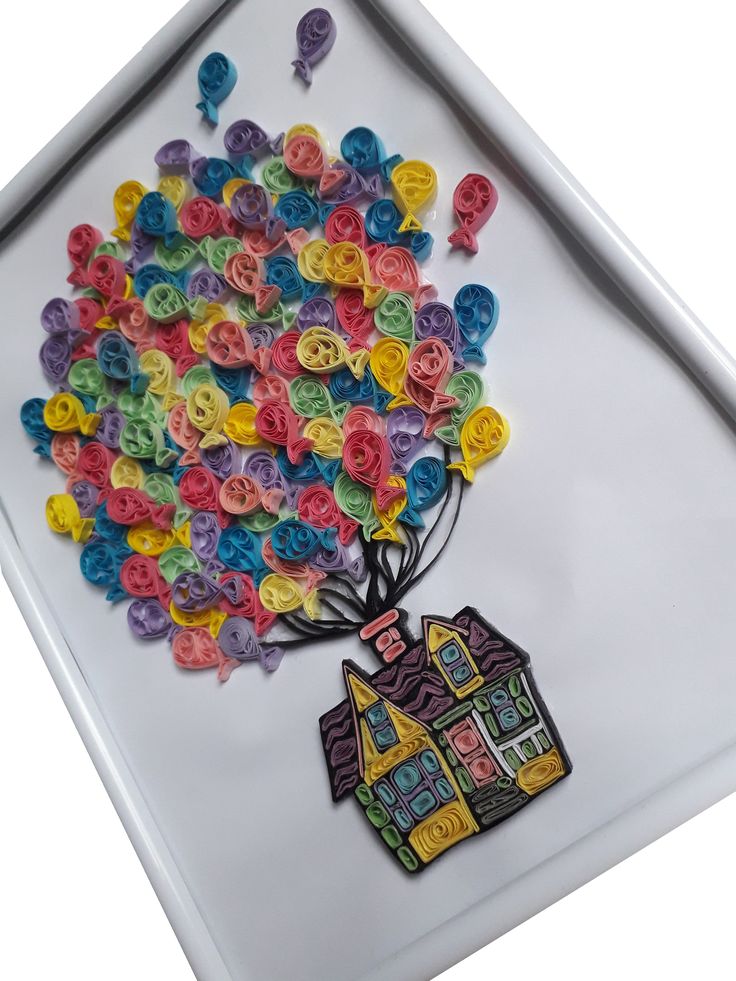 there is a glass plate with buttons in the shape of a house and a tree