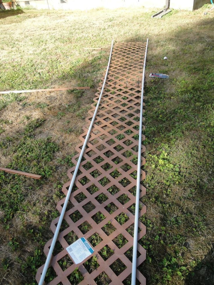 a metal grate laying in the grass