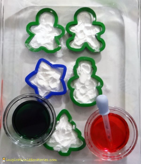 the cookie cutters are decorated with icing