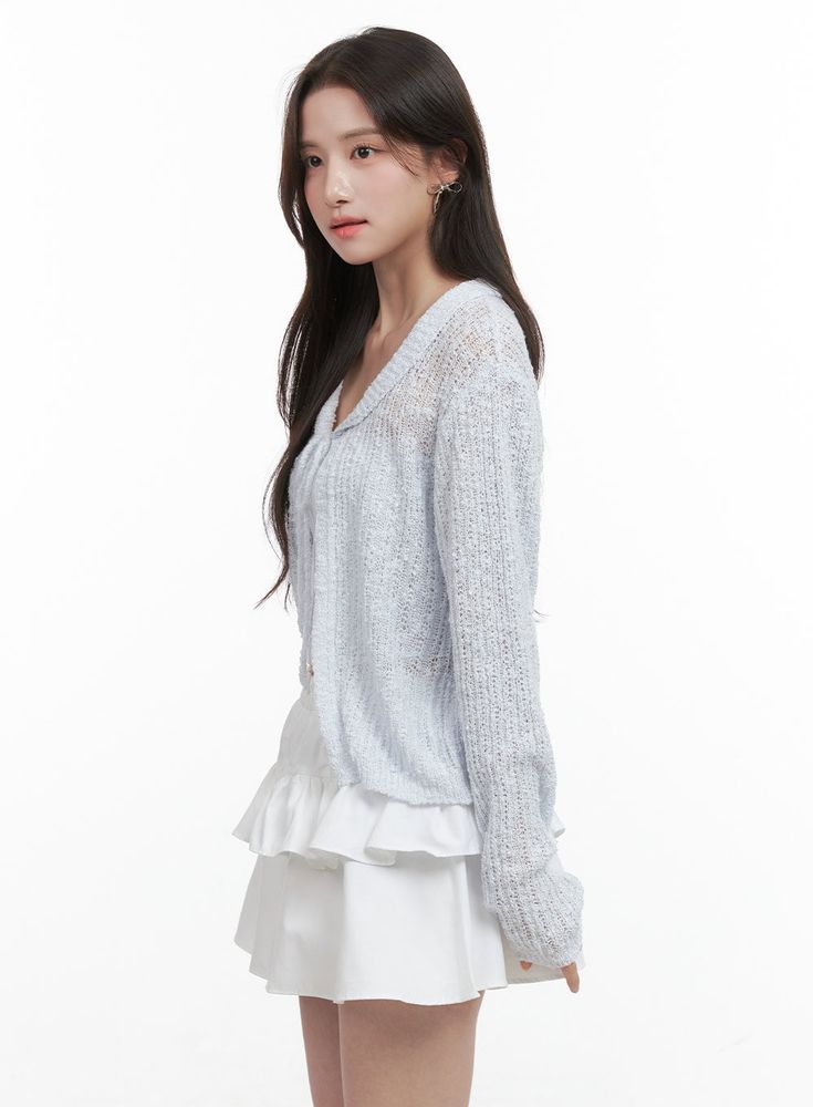 Product Detail Style : Romantic, Feminine Occasion : Back to school Detail : Ribbon, See-through Material : Acrylic, Knit Sleeve : Long sleeve Neck : Collar Acrylic100 Color : Light blue, Black, White Made in Korea Model Size Model is wearing size S/M and the color Light blue. Height : 5'5" | 164cm / Top : XS / Bottom : S (25 inch) .prddescription table, .prddescription td, .prddescription th { border : 1px solid black; border-collapse : collapse; padding: 10px; } Size(Inch) Size Shoulder Bust S Casual Knit Cardigan For Layering, Fitted Casual Cardigan With Pointelle Knit, Casual Open Knit Cardigan For Layering, Casual Open Knit Cardigan For Day Out, Casual Open Knit Cardigan For Spring, Spring Casual Knitted Cardigan, Fitted Open Knit Casual Cardigan, Casual Fitted Pointelle Knit Cardigan, Casual Pointelle Knit Cardigan