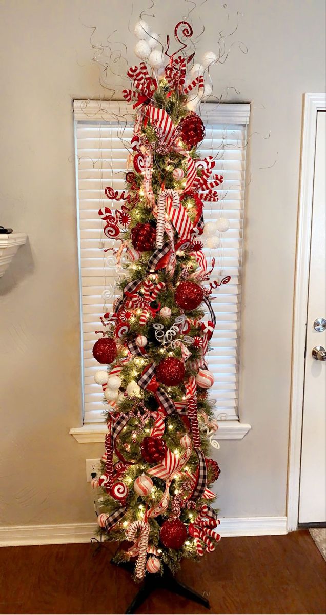 a christmas tree decorated with candy canes and ornaments