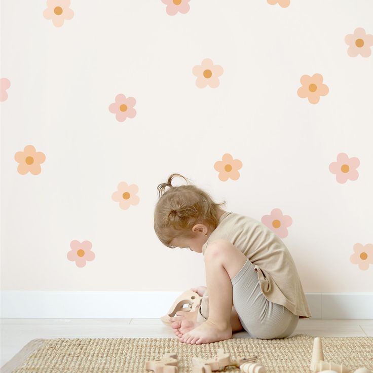 PRICES MAY VARY. PINK BOHO DAISY FLOWERS WALL DECALS: Infuse your space with a touch of boho chic! These daisies in soft pink and beige hues bring a warm, stylish atmosphere to any room. SCOPE OF DELIVERY: The Set Contains 17 Flowers, That Measure 3.15 x 3.15 inches. HASSLE-FREE APPLICATION: Featuring Self-Adhesive Technology, our decals easily adhere to both smooth and minimally textured surfaces like walls, doors, and cupboards—no tools required. CLEAN REMOVAL: Our wall stickers detach seamlessly without leaving sticky residue behind, preserving the integrity of your surfaces. REUSABLE & VERSATILE: Crafted from flexible material, these decals can be removed and repositioned, offering the freedom to refresh your child's room decor whenever inspiration strikes. Captivating Wall Decals for Flower Playroom, Playroom Decals, Toddler Wall Decor, Childrens Bedroom, Stick Art, Removable Wall Stickers, Design A Space, Boho Flowers, Playroom Wall Art