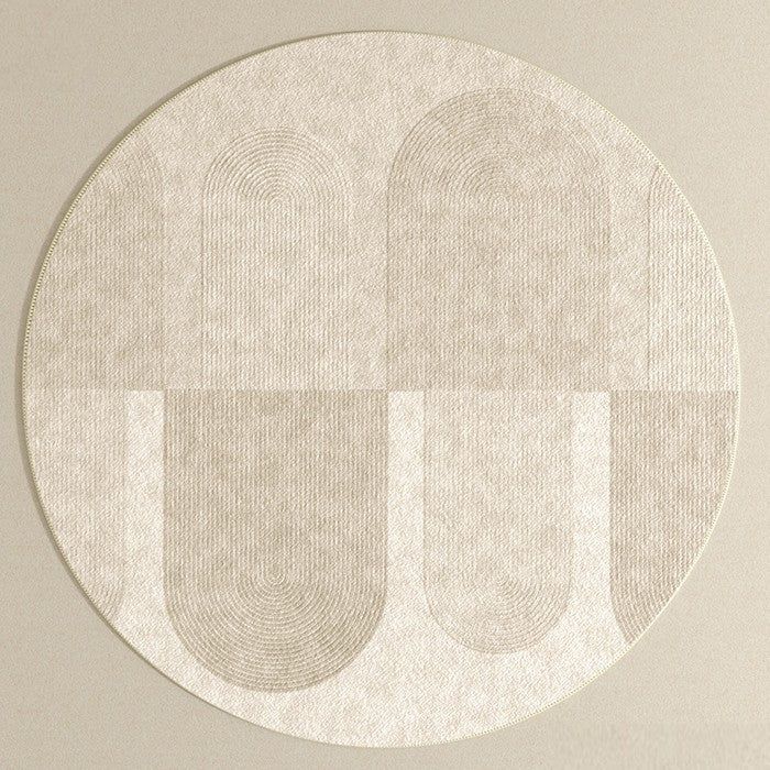 a round white rug with two circles on the bottom and one circle in the middle