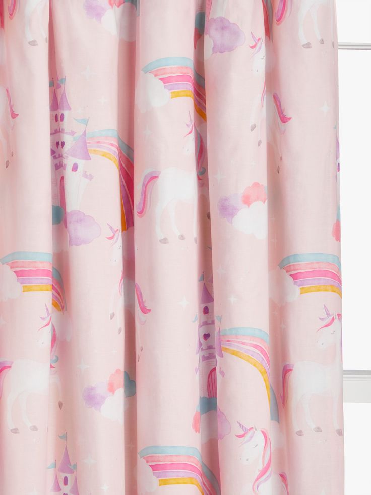 a pink curtain with unicorns and rainbows on it