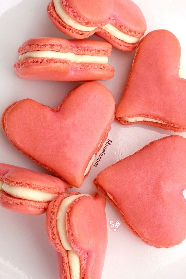 four heart shaped pastries on a plate