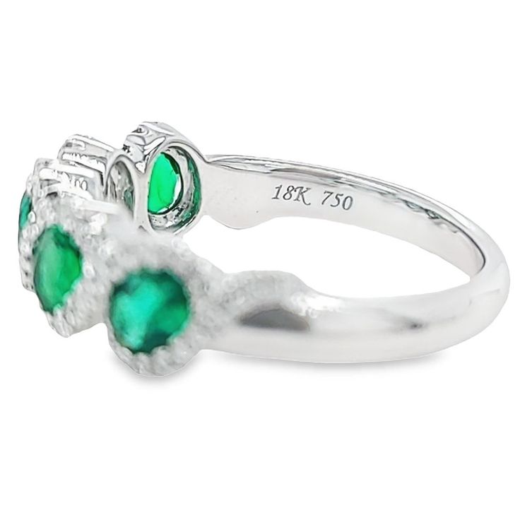 18 Karat White Gold Ring Featuring 5 Oval Emeralds Totaling 0.99 Carats Accented by 74 Round Diamonds of VS Clarity and G Color Totaling 0.25 Carats. Finger Size 6.5. Jae's Jewelers includes one ring sizing service on most ring purchases; please indicate desired size in checkout notes. Emerald And Diamond Ring, White Gold Ring, One Ring, White Gold Rings, Gold Ring, Round Diamonds, Diamond Ring, Gold Rings, Emerald