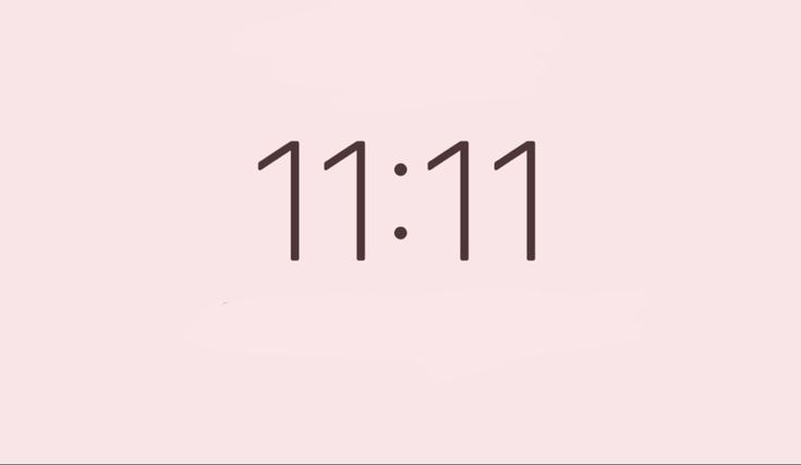 the numbers 11 11 11 are written in black on a light pink background with small dots