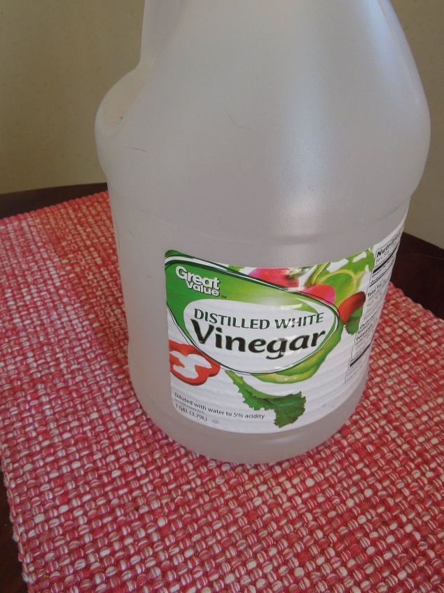 a gallon of vinegar sitting on top of a table