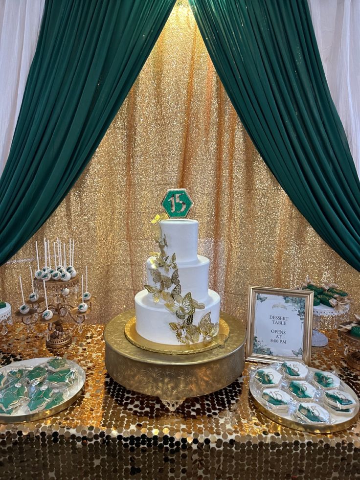 a table topped with a white and green cake