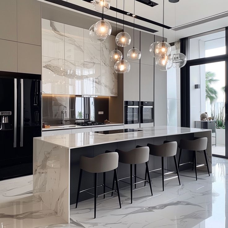 a modern kitchen with marble counter tops and bar stools