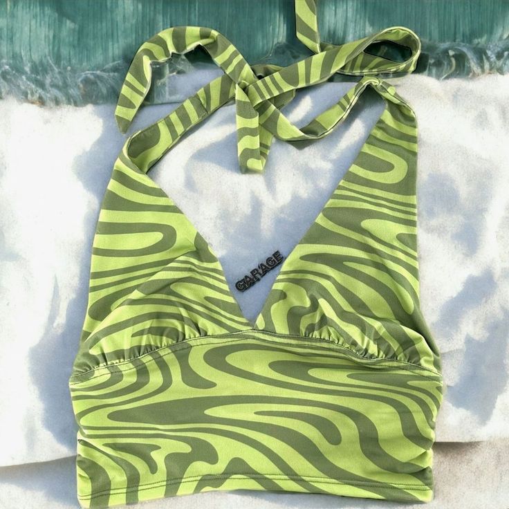 New/Nwt Garage Rebecca Green Swirl Print Ruched Halter Top Features: Ruched Under Bust Ties Behind Neck Green Swirl Print Jersey Measurements: Size - Small Bust - 24" Length - 6" Under Arm To Hem All Measurements Are Approximate Color Appearance May Vary Depending On Your Monitor Settings. Item Specifics: Fabric Content - 95% Polyester/5% Spandex Care - Hand Wash Condition - New With Tag Trendy Green Top With Drawstring, Green Sleeveless Top With Drawstring, Green Ruched Beach Top, Ruched Halter Top, Black Going Out Tops, White Bandeau Top, Rebecca Green, Cropped White Tee, Lace Halter Top