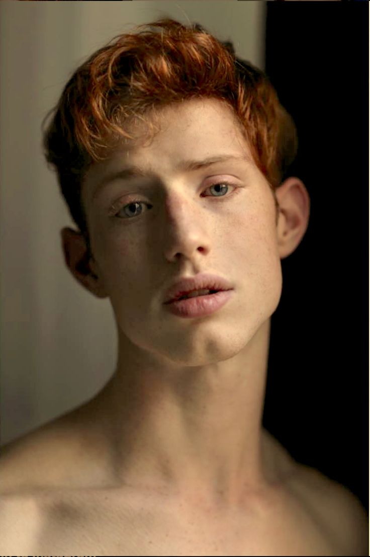 a young man with red hair and no shirt