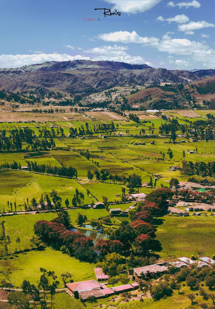 an aerial view of a lush green valley