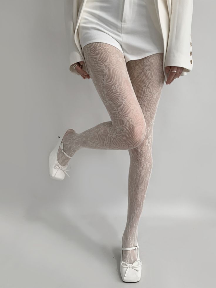 Introducing our enchanting Floral Pattern Lolita Fishnet Tights, the perfect blend of elegance and whimsy for your spring and autumn wardrobe. These tights feature a delicate floral pattern that adds a touch of romance and charm to any outfit. Elegant Beige Thigh High Tights, Cream Thigh-high Hosiery, Elegant Fishnet Tights, Elegant Tight Fishnet Hosiery, Lace Tight Hosiery, White Tight Hosiery For Spring, Spring White Tight Hosiery, White Tight Spring Hosiery, Spring Lace Stretch Tights