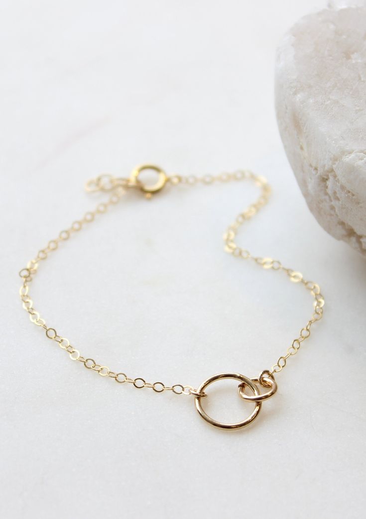 The TINY collection is home to our most dainty + delicate pieces. Tiny links measure 1/2" wide and are attached to our most delicate chain. Bracelet is adjustable from 6.5 - 7". Available in Sterling Silver and 14kt Gold Fill. If you need a smaller or larger size, let us know in the "Notes" at checkout. Handmade in Eau Claire, WI All of our jewelry is handmade to order just for you so each piece will be unique and may vary slightly from what is pictured. Due to the handmade nature of our product Be Unique, Delicate Chain, 14kt Gold, Infinity Bracelet, Link Bracelets, Chain Bracelet, Handmade Natural, Gold Filled, Bracelet