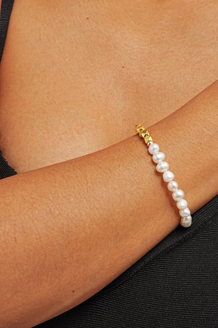 Elevate your wrist game with our Zarina Pearl Mix Bracelet – a stunning blend of pearls and gems crafted to adorn your wrist with timeless elegance. Picture yourself effortlessly commanding attention at every turn, your wrist adorned with lustrous pearls and shimmering gems, a symbol of your unique style and sophistication. Embrace the power of femininity with every flick of your wrist as this bracelet whispers tales of timeless beauty and grace. Pearl Drop Bracelet Jewelry, Pearl Bracelet With Pearl Drop, Adjustable Pearl Oyster Bracelet Jewelry, Elegant Pearl Charm Bangle Jewelry, Minimalist Pearl Jewelry With Oyster Bracelet, Formal Pearl Bracelet With Pearl Charm, Pearl White Pearl Bracelet Jewelry, Pearl White Pearl Bracelet, Luxury Pearl Chain Beaded Bracelet Gift