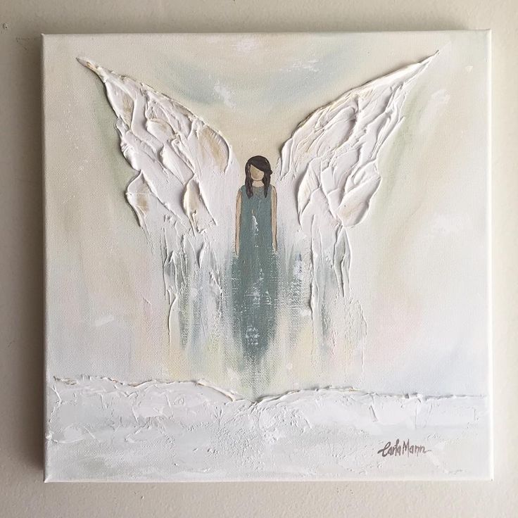 an angel painting with white wings on a wall