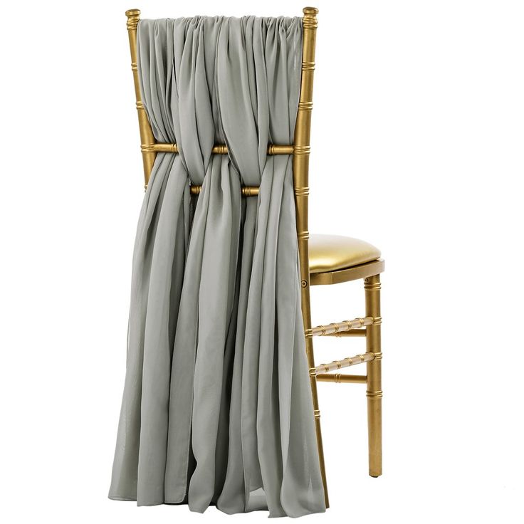 a gold chair with a gray drape draped over it's seat and back