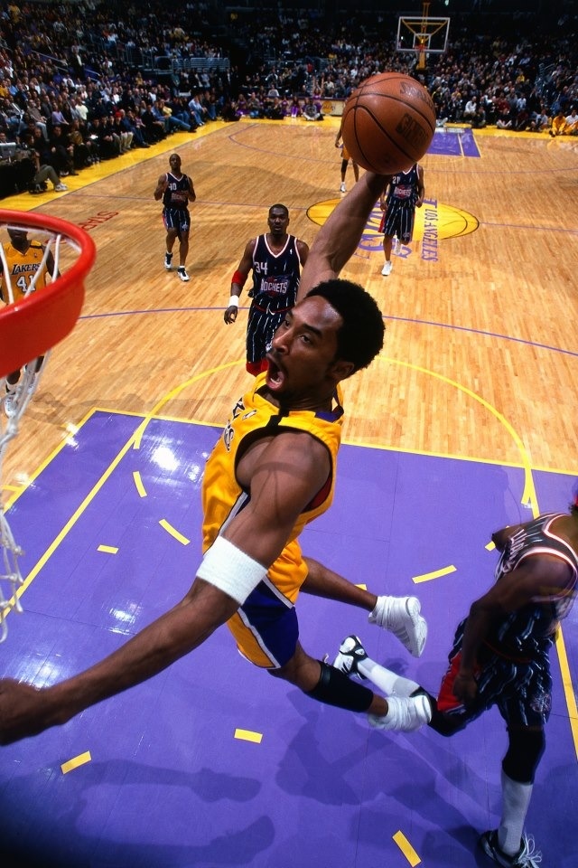 a basketball player dunking the ball into the hoop