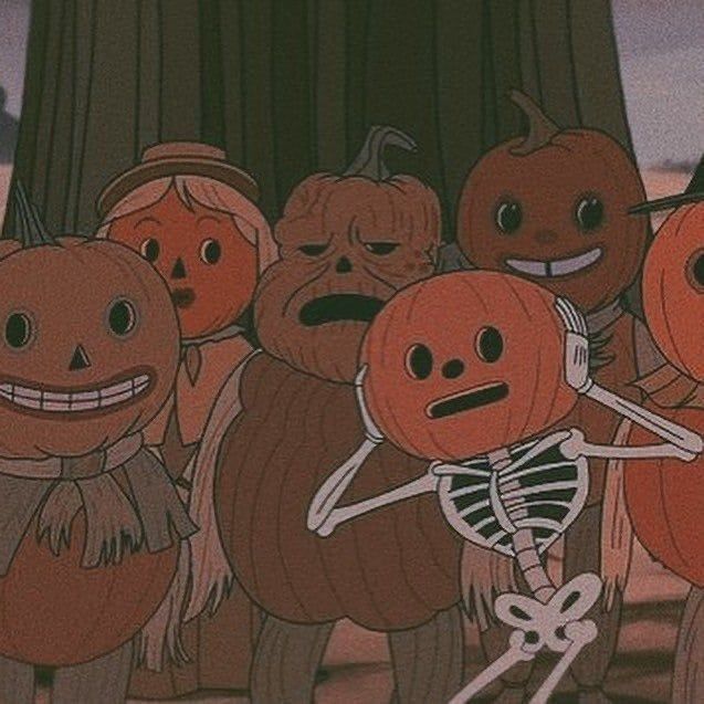 a group of pumpkins that are standing in front of a tree with faces drawn on them