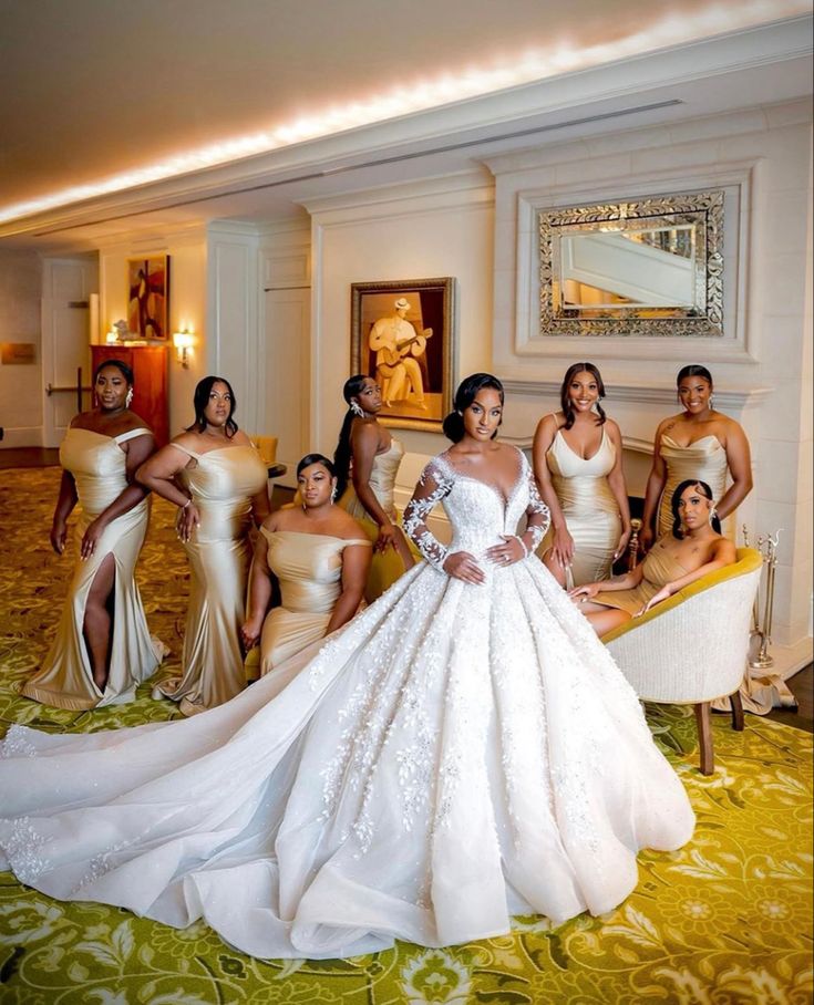 the bridesmaids are posing for a photo in their wedding gowns and dresses