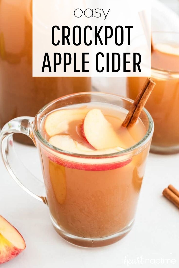 an easy crockpot apple cider recipe with apples and cinnamon in the background