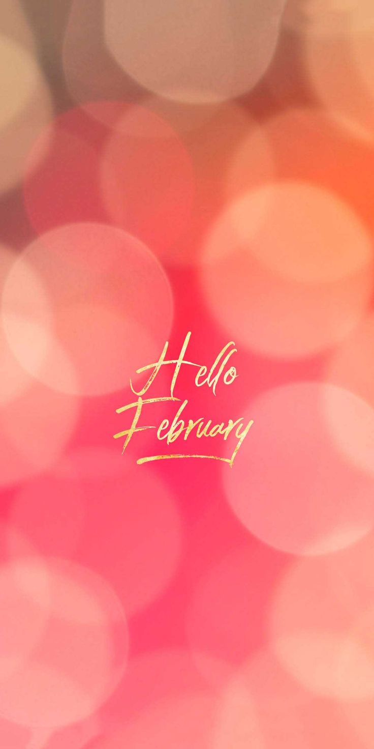 blurry boke background with the word hello february written in gold on it's left side