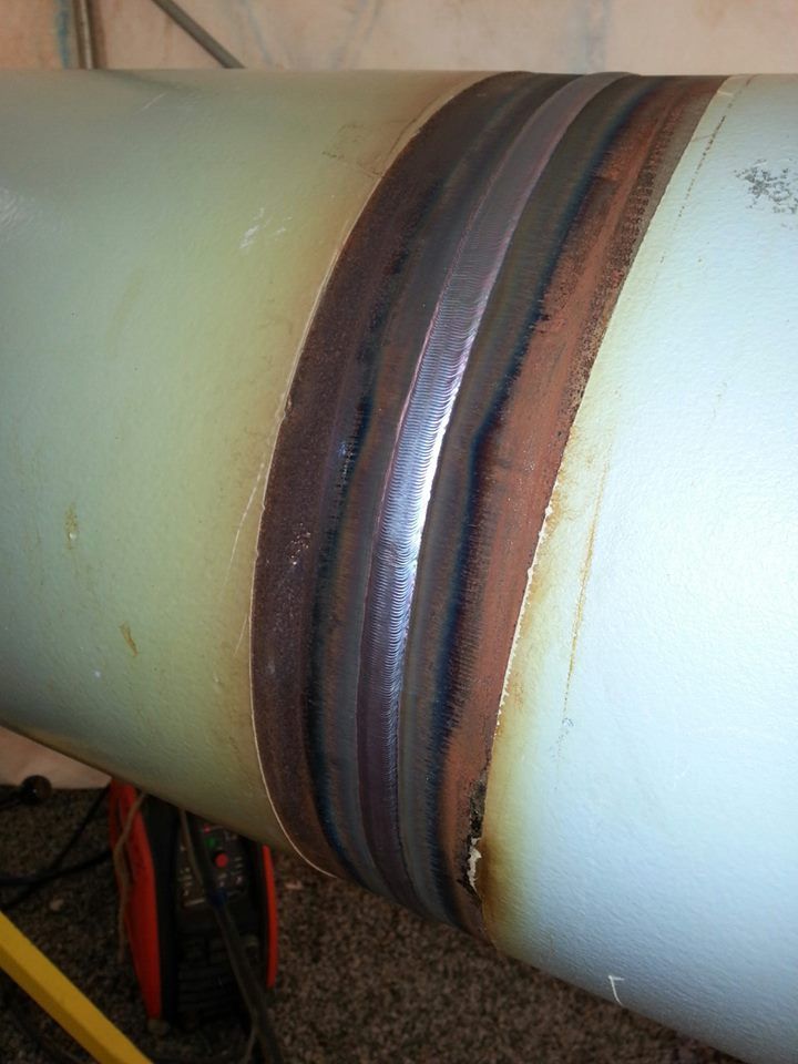 a close up view of the side of a pipe with different colored lines on it