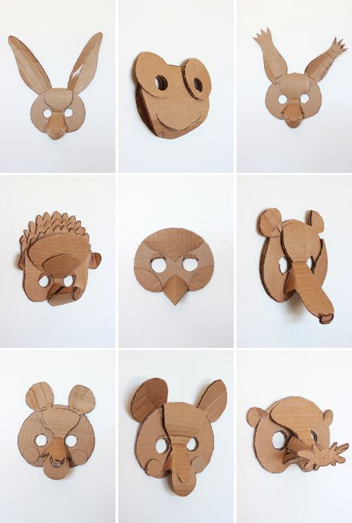 wooden masks made to look like animals with different shapes and sizes, all showing their faces