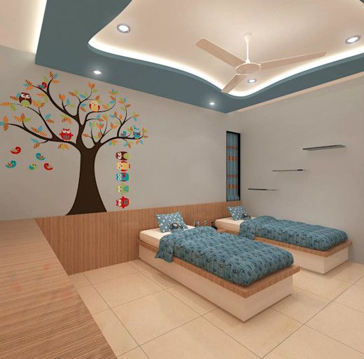 two beds in a room with a tree painted on the wall behind them and blue bedding