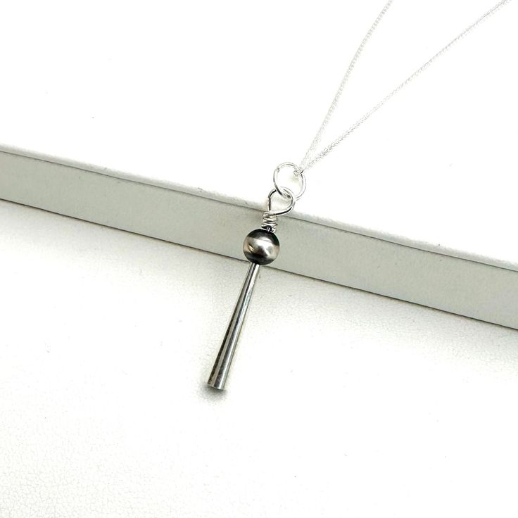 Necklace is adjustable at 18-20 inches. Silver Adjustable Long Charm Necklaces, Adjustable Long Silver Charm Necklace, Silver Adjustable Long Charm Necklace, Adjustable Silver Long Charm Necklace, Adjustable Teardrop Pendant Drop Necklace, Adjustable Minimalist Teardrop Pendant Charm Necklaces, Adjustable Dangle Charm Necklaces In Sterling Silver, Adjustable Sterling Silver Dangle Charm Necklaces, Adjustable Clavicle Chain Drop Necklace